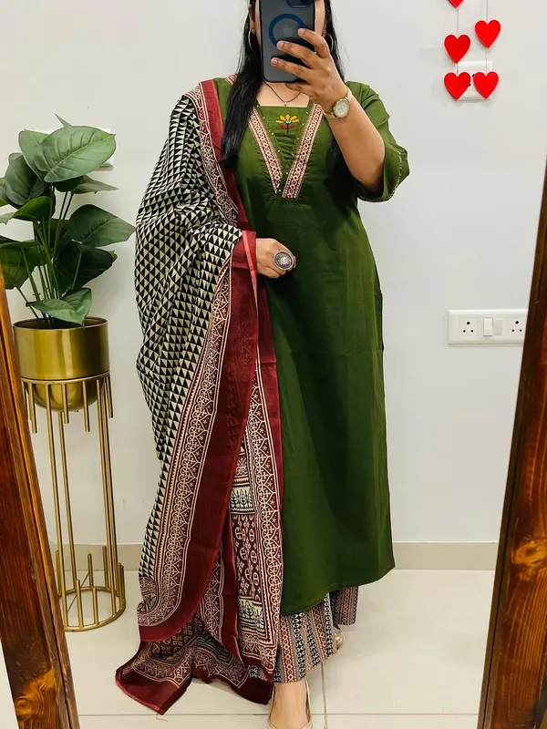 Dhabu_cotton_suit_set_with_heavy_embroidery_work_on_the_yoke_and_pockets__with_border_detailing_on_Sleeves.