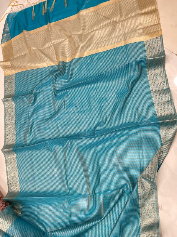 Humairah_Presents_Sky_Blue_Organza_Zari_Plain_Striped_with_Gold_Zari_Border_with_Contrast_Gold_Pallu_and_Sky_Blue_Blouse