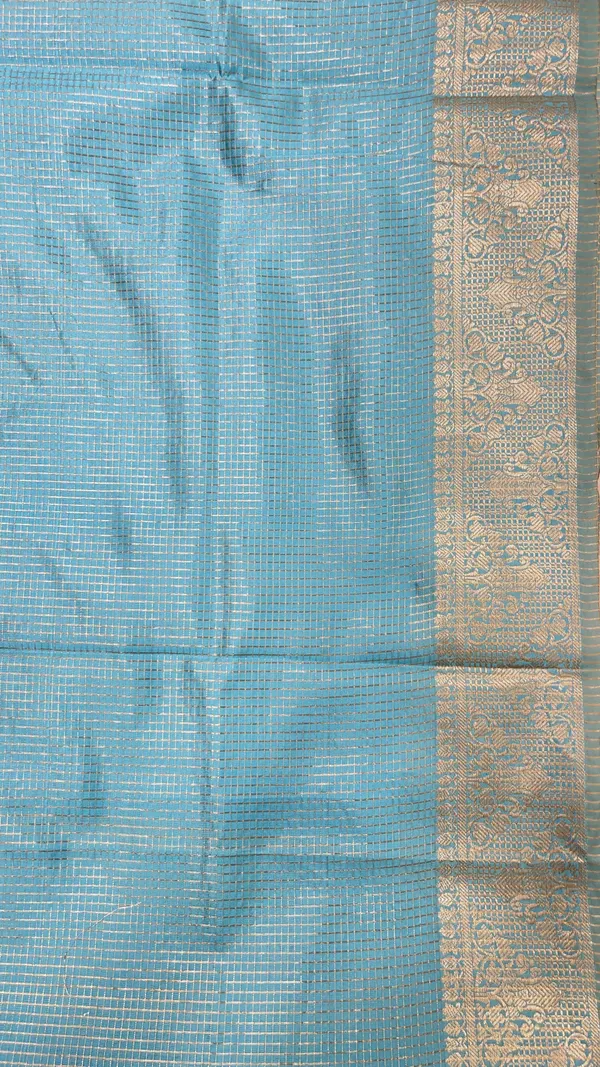 Humairah_Presents_Light_Blue_Organza_Zari_Plain_Striped_with_Gold_Zari_Border_with_Contrast_Gold_Pallu_and_Light_Blue_Blouse