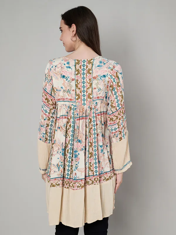 round_neck_,printed_full_sleeves,_buttons_at_yoke_Embroidery_at_yoke_and_bottom/sleeves