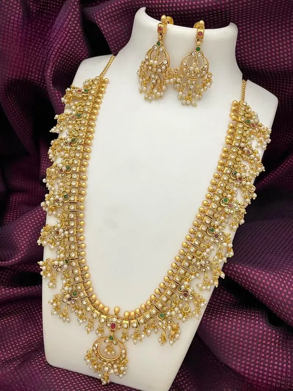 Exquisite_Kundan_Hanging_Pearl_Temple_Haram_Set_For_Women