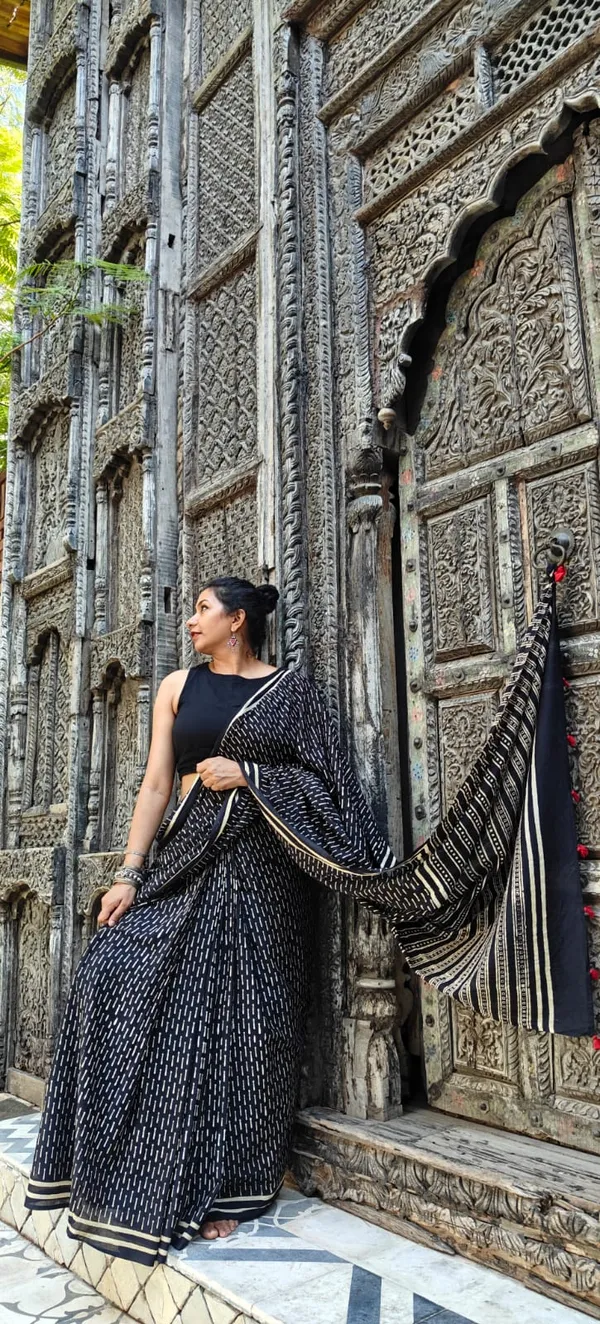 Noir_Cream_With_Scarlet_Tassels_Mulmul_Saree_With_Unstitched_Blouse_Piece