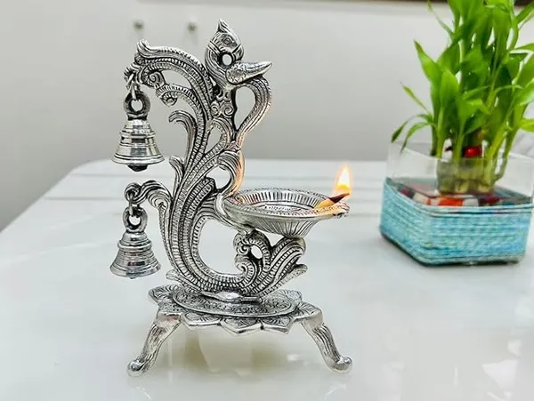 Peacock_Antique_Design_Single_batti_Diya_for_Home_Decor_Aarti_Home_Temple_Decoration_Metal_Table_Diya_Size_L14_x_W9_x_H20_cm_(Silver_Metal,_Pack_of_1_Pcs)