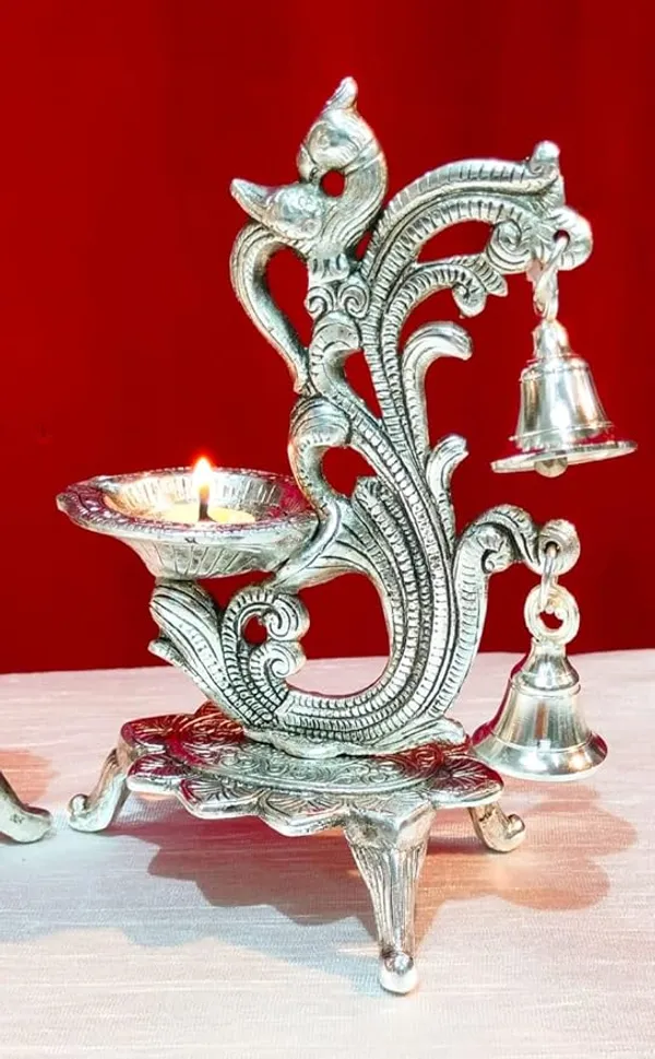 Peacock_Antique_Design_Single_batti_Diya_for_Home_Decor_Aarti_Home_Temple_Decoration_Metal_Table_Diya_Size_L14_x_W9_x_H20_cm_(Silver_Metal,_Pack_of_1_Pcs)