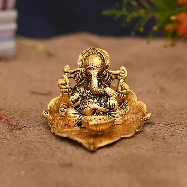Ganesh_Idol_on_Leaf_-_Lord_Ganesha_with_Diya_-_Metal_Diya_for_Diwali_Decoration_Items_Home_Decorative_Gift_Puja_Gifts_Corporate,_Diwali_Gift_Item