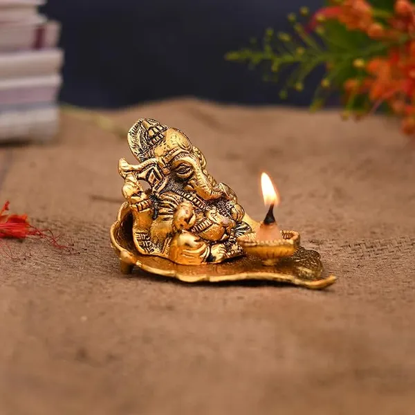 Ganesh_Idol_on_Leaf_-_Lord_Ganesha_with_Diya_-_Metal_Diya_for_Diwali_Decoration_Items_Home_Decorative_Gift_Puja_Gifts_Corporate,_Diwali_Gift_Item