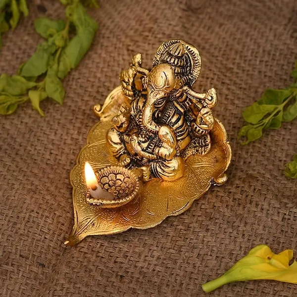 Ganesh_Idol_on_Leaf_-_Lord_Ganesha_with_Diya_-_Metal_Diya_for_Diwali_Decoration_Items_Home_Decorative_Gift_Puja_Gifts_Corporate,_Diwali_Gift_Item