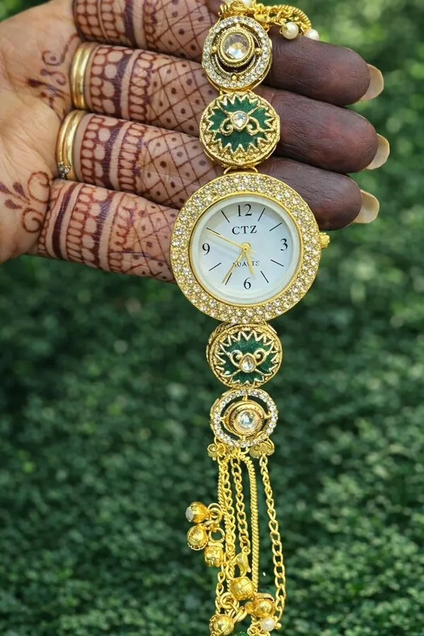 Handcrafted_Gold_Plated_Polki-Style_Bracelet_Watch_with_Green_Meenakari_Art_&_Tassels