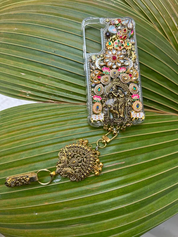 Radha_Krishna_Divine_Art_Phone_Case_with_Handcrafted_Kundan__with_saree_pin_phone_case_|_cover