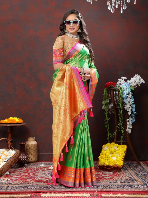 Green_Soft_Kanjivaram_Silk_With_Zari_Weaving_Design_And_Rich_Zari_Weaving_Pallu_Border_Saree