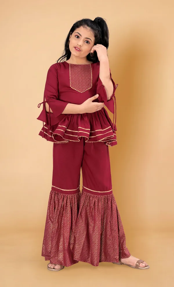 Maroon_Crepe_Peplum_Top_And_Sharara_Set_For_Girls