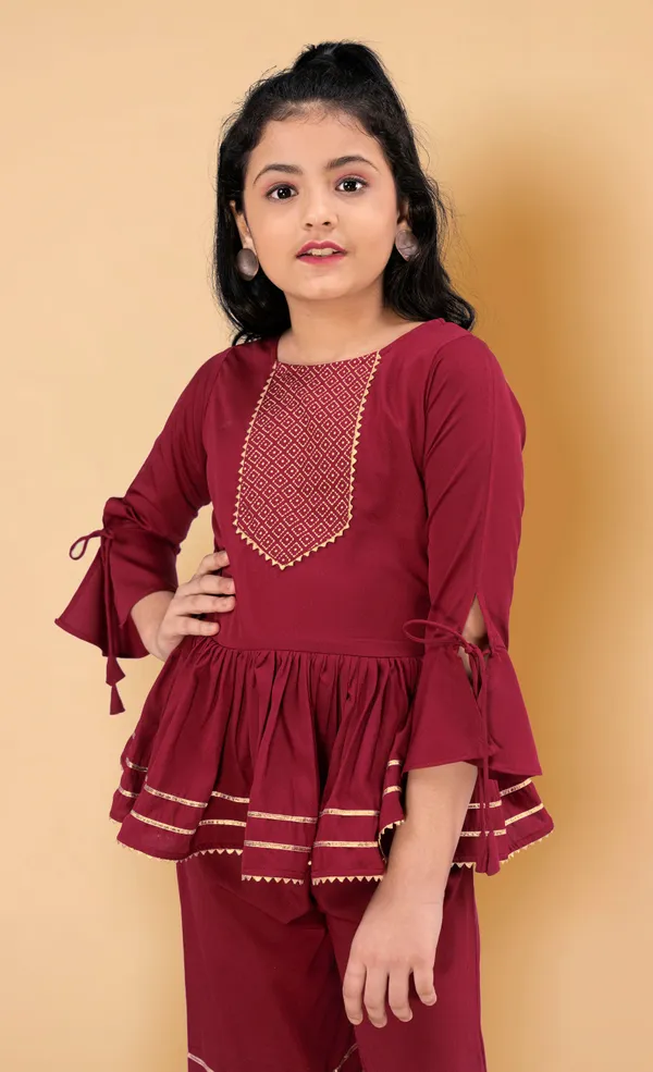 Maroon_Crepe_Peplum_Top_And_Sharara_Set_For_Girls