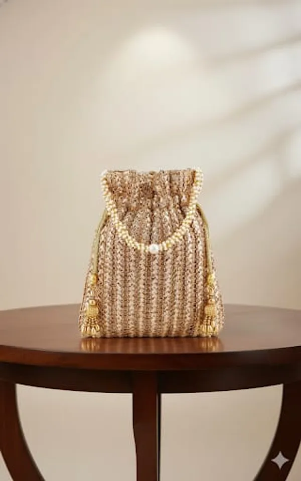 This_is_a_classic_Potli_bag,Beautiful_drawstring_pouch_often_used_in_traditional_fashion
