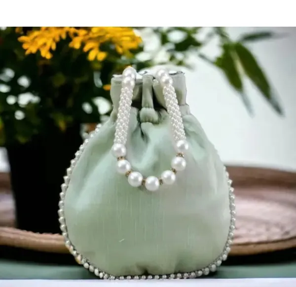 embroidery_handwork_potli_with_pearl_handle