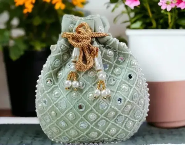 embroidery_handwork_potli_with_pearl_handle