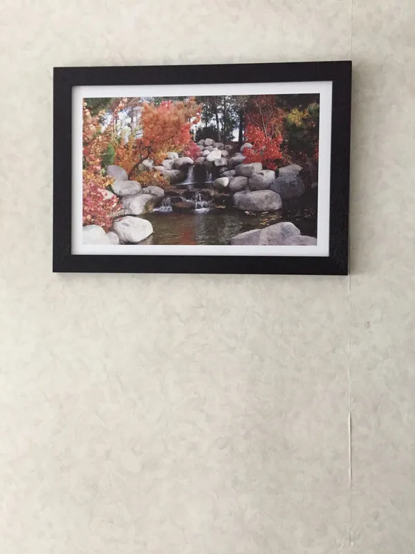 Waterfall_in_the_Rocks_in_the_Awesome_Blossom-_Nature_Theme_Wall_Decor,_Framed,_Multicolor