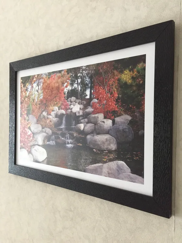 Waterfall_in_the_Rocks_in_the_Awesome_Blossom-_Nature_Theme_Wall_Decor,_Framed,_Multicolor