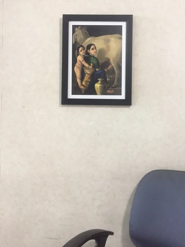 Yashoda_&_Bal-Krishna_with_a_Cow,_1870,_A_Raja_Ravi_Varma_Painting,_Framed,_Multicolor