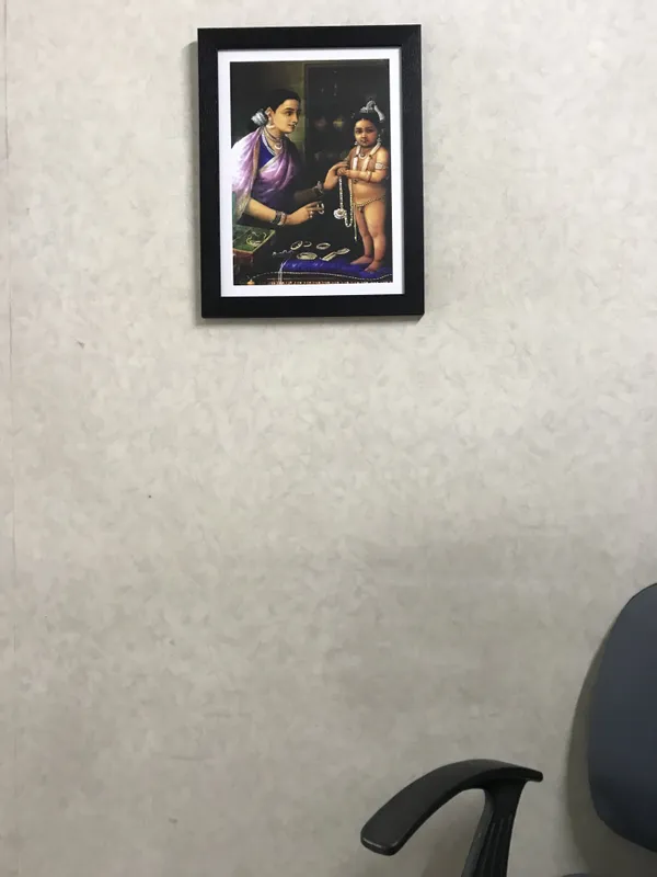 Yashoda_wearing_Bal-Krishna_Ornaments,_1879,_A_Raja_Ravi_Varma_Painting,_Framed,_Multicolor