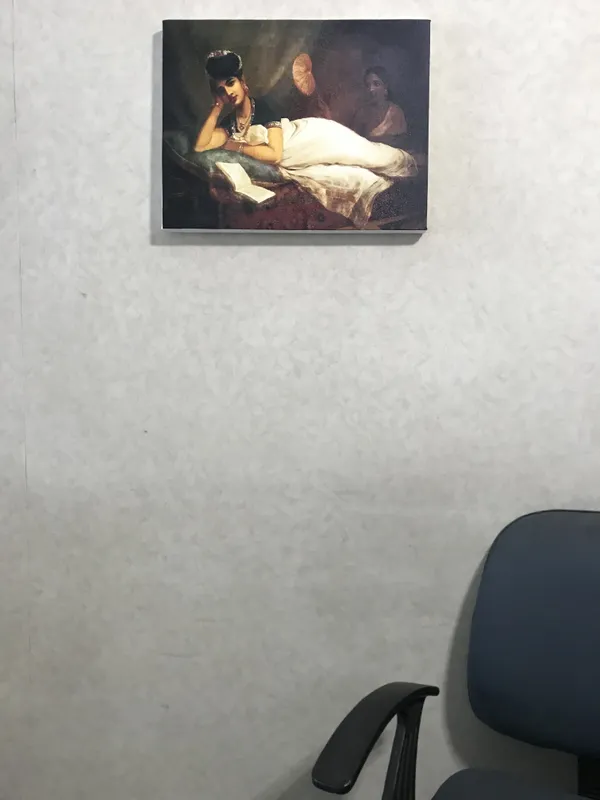 Reclining_Nayar_Lady,_1902,_A_Raja_Ravi_Varma_Painting,_Framed_Canvas,_Wall_Decor,_Multicolor