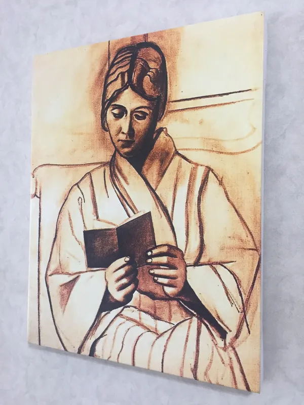 Woman_(Olga)_Reading_A_Book,_1920,_A_Painting_by_Pablo_Picasso,_Framed_Canvas,_Wall_Decor,_Multicolor