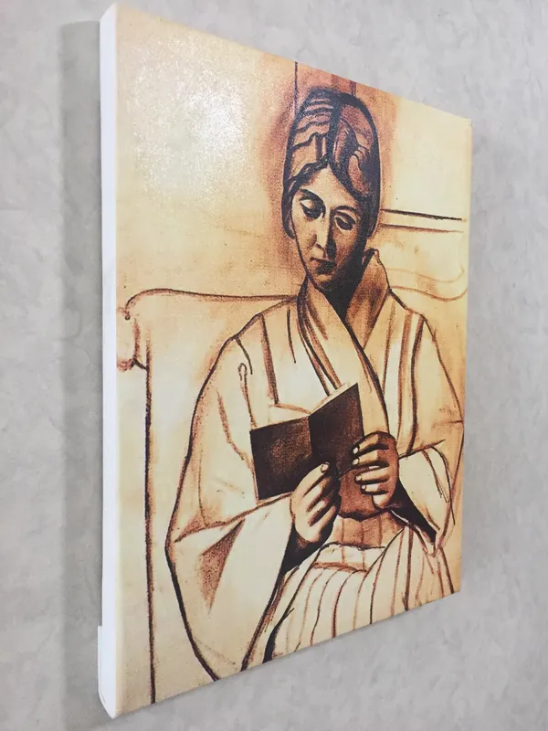 Woman_(Olga)_Reading_A_Book,_1920,_A_Painting_by_Pablo_Picasso,_Framed_Canvas,_Wall_Decor,_Multicolor