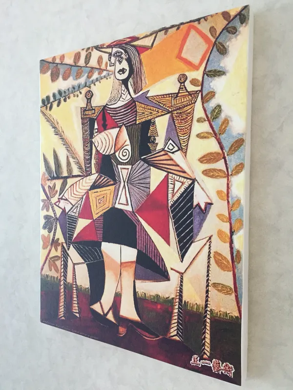 Seated_Woman_in_A_Garden,_1938,_A_Painting_by_Pablo_Picasso,_Framed_Canvas,_Wall_Decor,_Multicolor