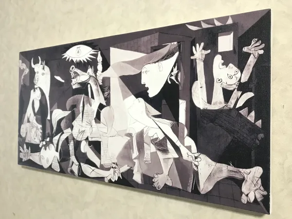 �Guernica_&_Massacre_in_Korea_,_Paintings_by_Pablo_Picasso,_Framed_Canvas,_Set_of_2,_Multicolor