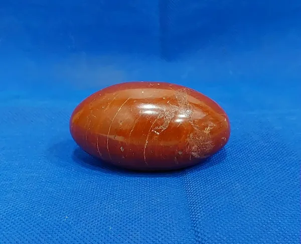 295_RED_JASPER_CRYSTAL_LINGAM_(_Weight_-_110_Gms_/_Width_-_1.5_Inch_/_Length_-_2.5_Inch_)