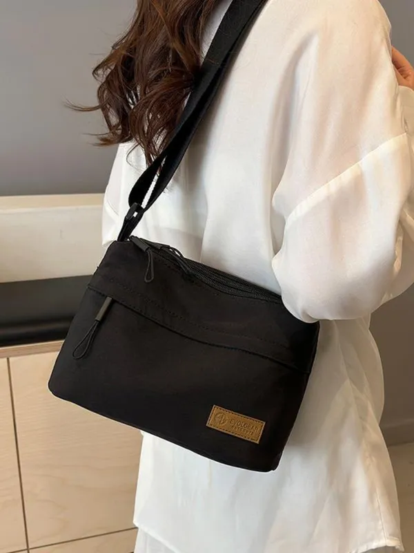 Black_Lightweight_Nylon_Crossbody_Bag_with_Multi-Pocket_Design