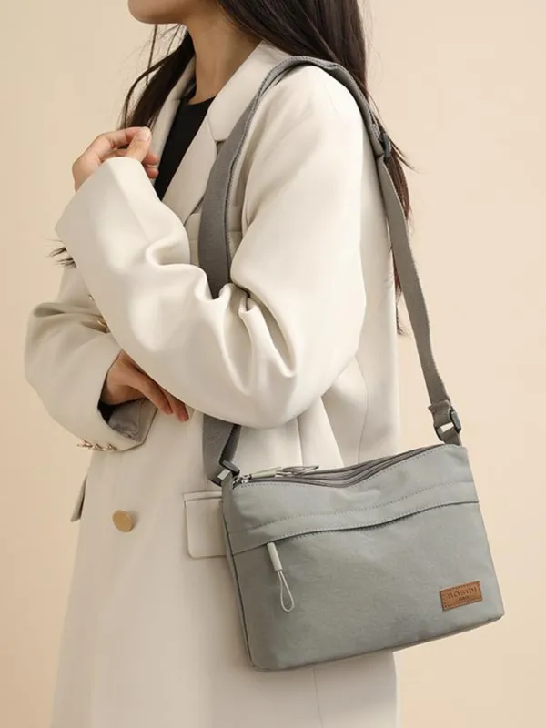 Grey_Lightweight_Nylon_Crossbody_Bag_with_Multi-Pocket_Design
