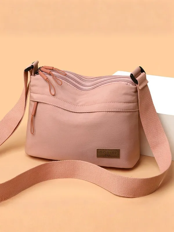 Pink_Lightweight_Nylon_Crossbody_Bag_with_Multi-Pocket_Design