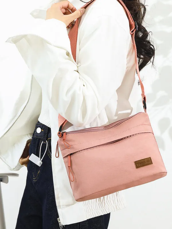 Pink_Lightweight_Nylon_Crossbody_Bag_with_Multi-Pocket_Design