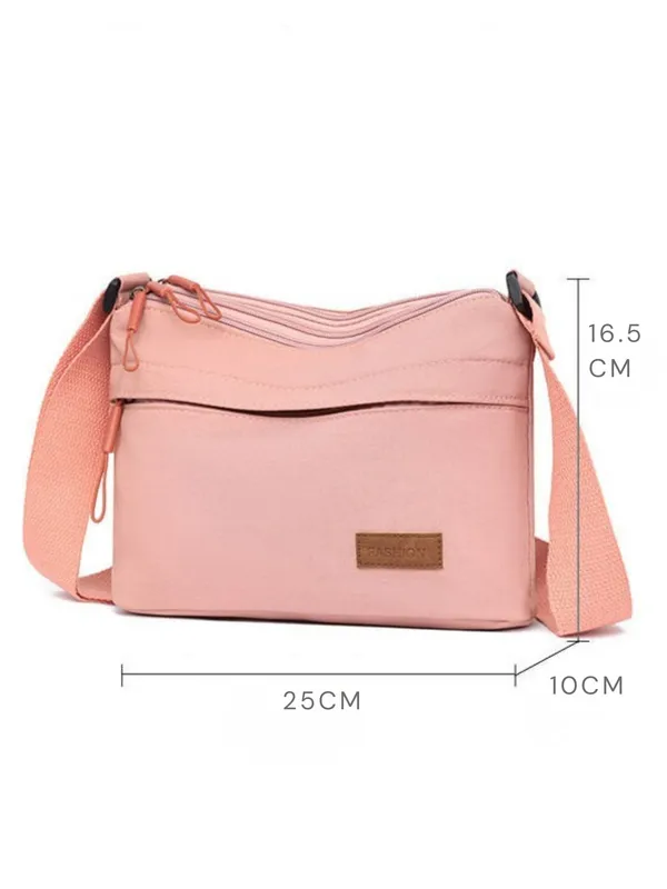 Pink_Lightweight_Nylon_Crossbody_Bag_with_Multi-Pocket_Design