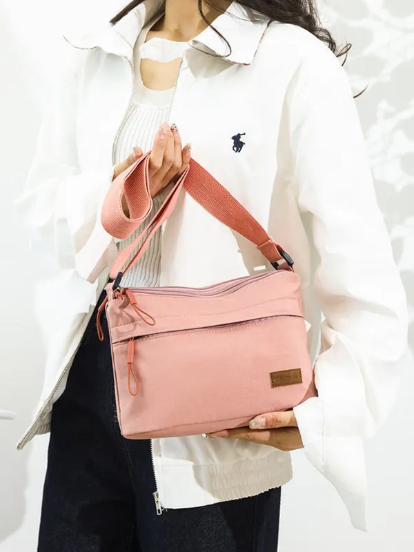 Pink_Lightweight_Nylon_Crossbody_Bag_with_Multi-Pocket_Design