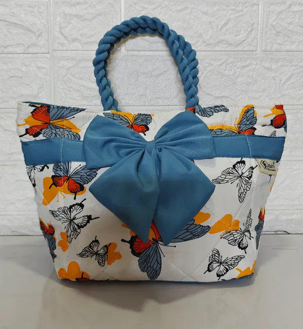 Multicolor_Fabric_&_Metal_Bow_Lunch_Storage_Bag_(10_Litres)