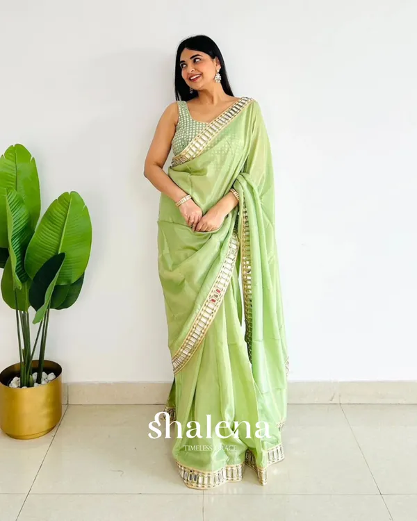 Dazzling_Pista_Satin_Silk_Mirror_Work_Saree_With_Splendorous_Blouse_Piece