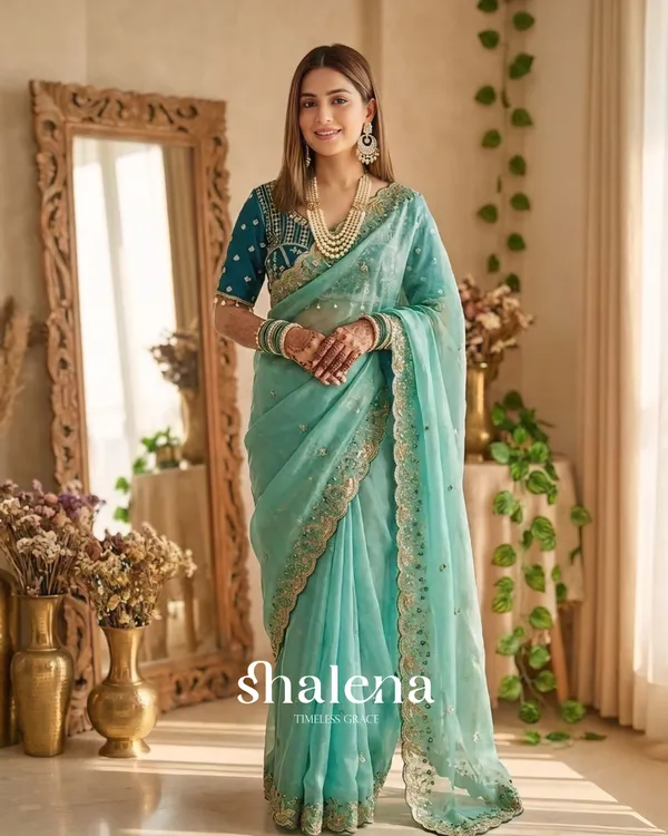 Extraordinary_Turquoise_Fendy_Silk_Sequence_Embroidery_Work_Saree_With_Stitched_Blouse
