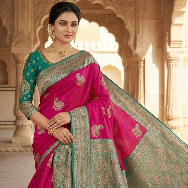 Pink_Silk_Saree_With_Golden_Peacock_Motifs_And_Teal_Border