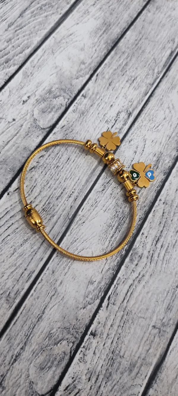 Elegant_Gold_Bracelet_with_Lucky_Charms_and_Evil_Eye_Accents