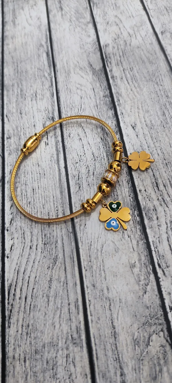 Elegant_Gold_Bracelet_with_Lucky_Charms_and_Evil_Eye_Accents