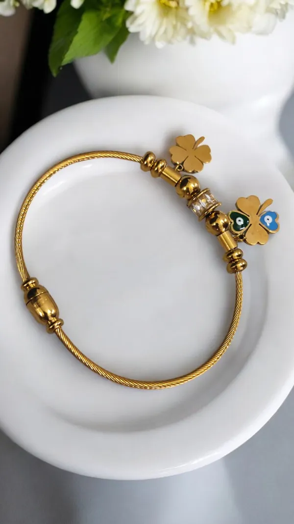 Elegant_Gold_Bracelet_with_Lucky_Charms_and_Evil_Eye_Accents