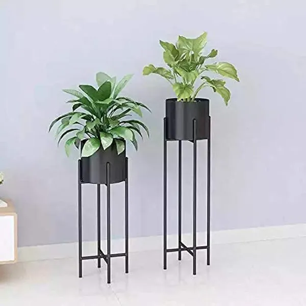 Black_metal_plant_stand_with_a_mid-century_modern_design,_suitable_for_large_plant_pots,_in_black.
