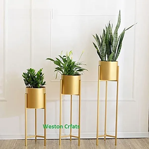 Gold_metal_plant_stand_with_3_GI_pots,_black_powder-coated_metal_planter_stand_for_indoor_and_outdoor_use._Gold_stand_with_black_pots.