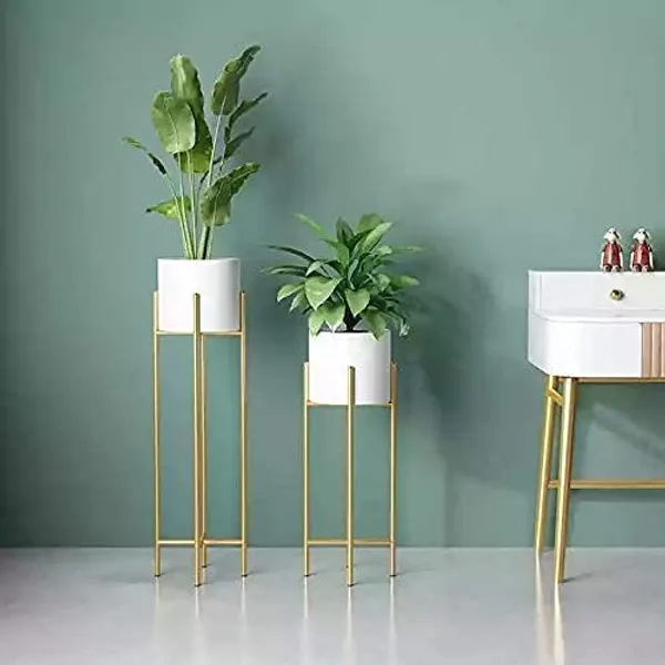 Gold_metal_plant_stand_with_a_mid-century_modern_design,_suitable_for_large_plant_pots,_in_white.