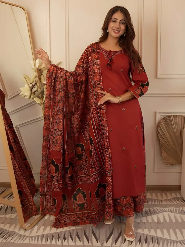 Stylish_heavy_cotton_kurta_set_with_detailed_neckline_embroidery_and_coordinated_pant_and_dupatta