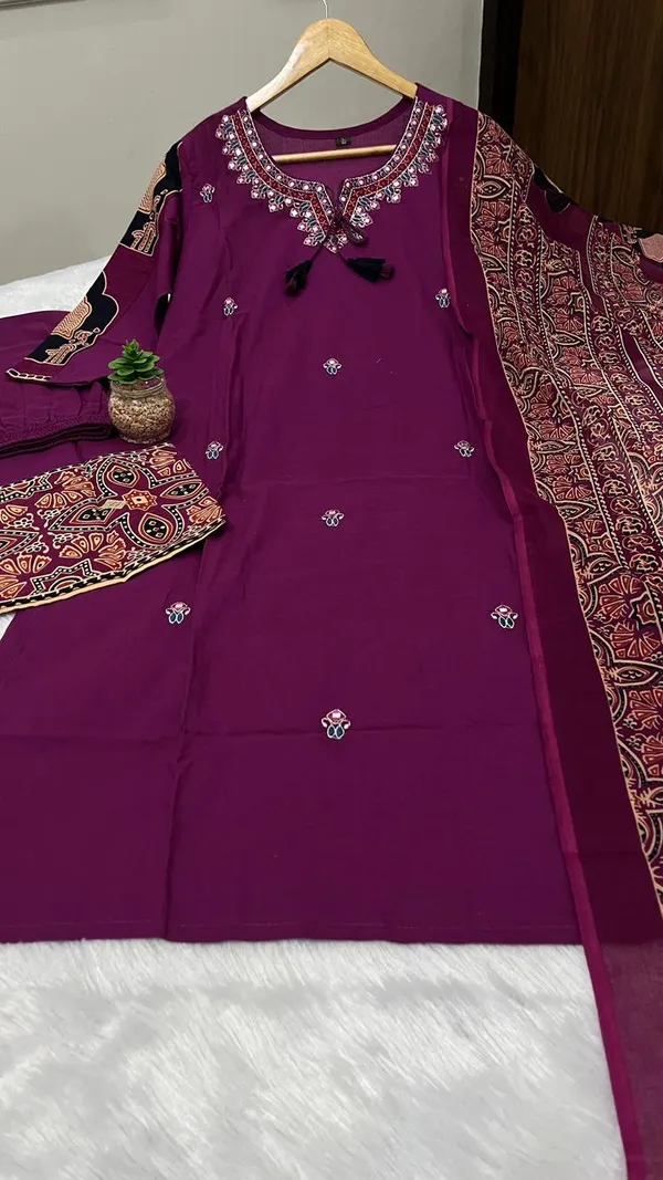 Stylish_heavy_cotton_kurta_set_with_detailed_neckline_embroidery_and_coordinated_pant_and_dupatta