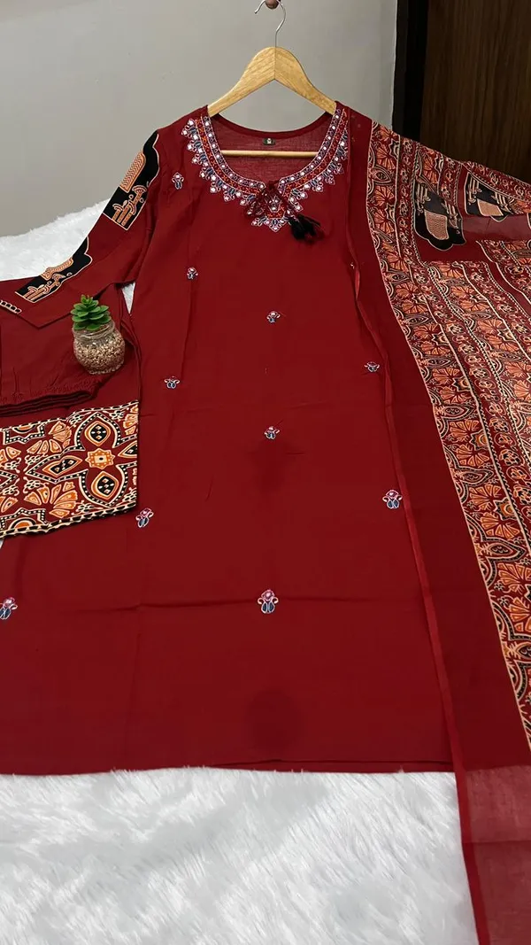 Stylish_heavy_cotton_kurta_set_with_detailed_neckline_embroidery_and_coordinated_pant_and_dupatta