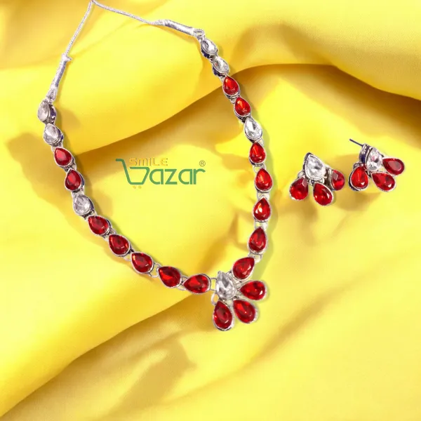 Elegant_Kundan_Necklace_Set_Adorned_With_Red_And_Clear_Kundan