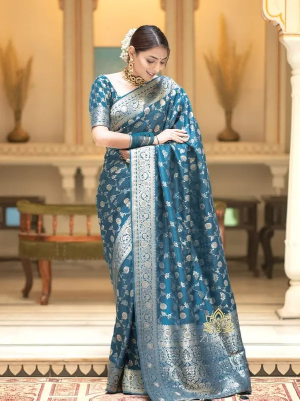Teal_Blue_Banarasi_Saree_New_Collection_�_Latest_Design_Soft_Lichi_Silk_Partywear_Sadi_With_Heavy_Brocade_Blouse,_Rich_Pallu,_and_Zari_Weaving_|_Trending_Wedding_Saree_for_Women